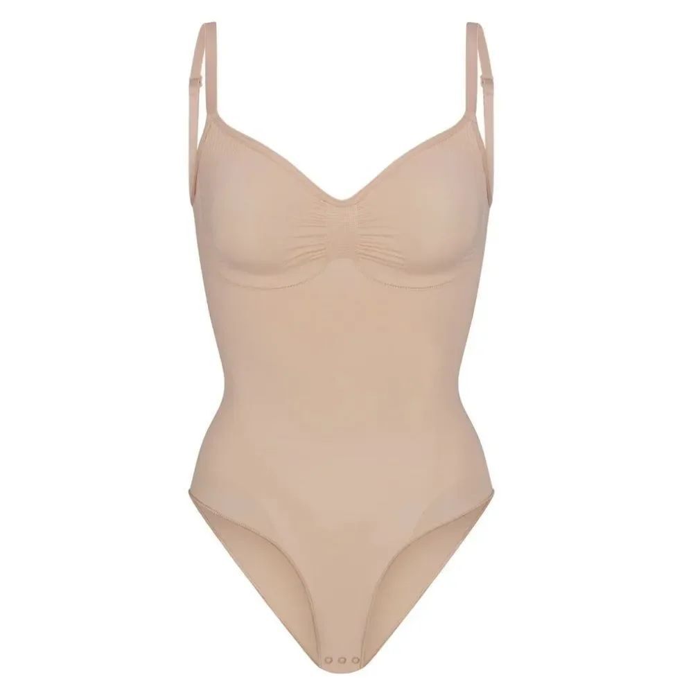 SKIMS Sculpting Seamless Brief Support Shaping Bodysuit In Clay Nude